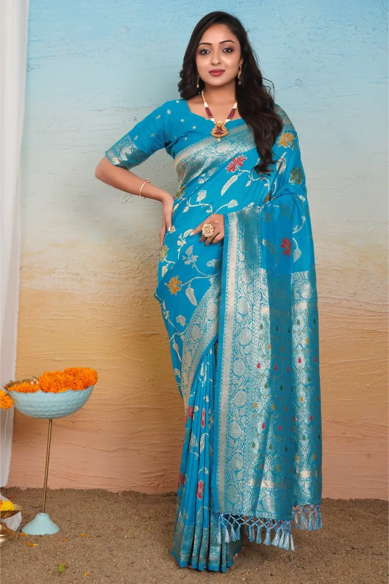 acqua blue dola silk saree with floral motifs silver zari border and tassel pallu