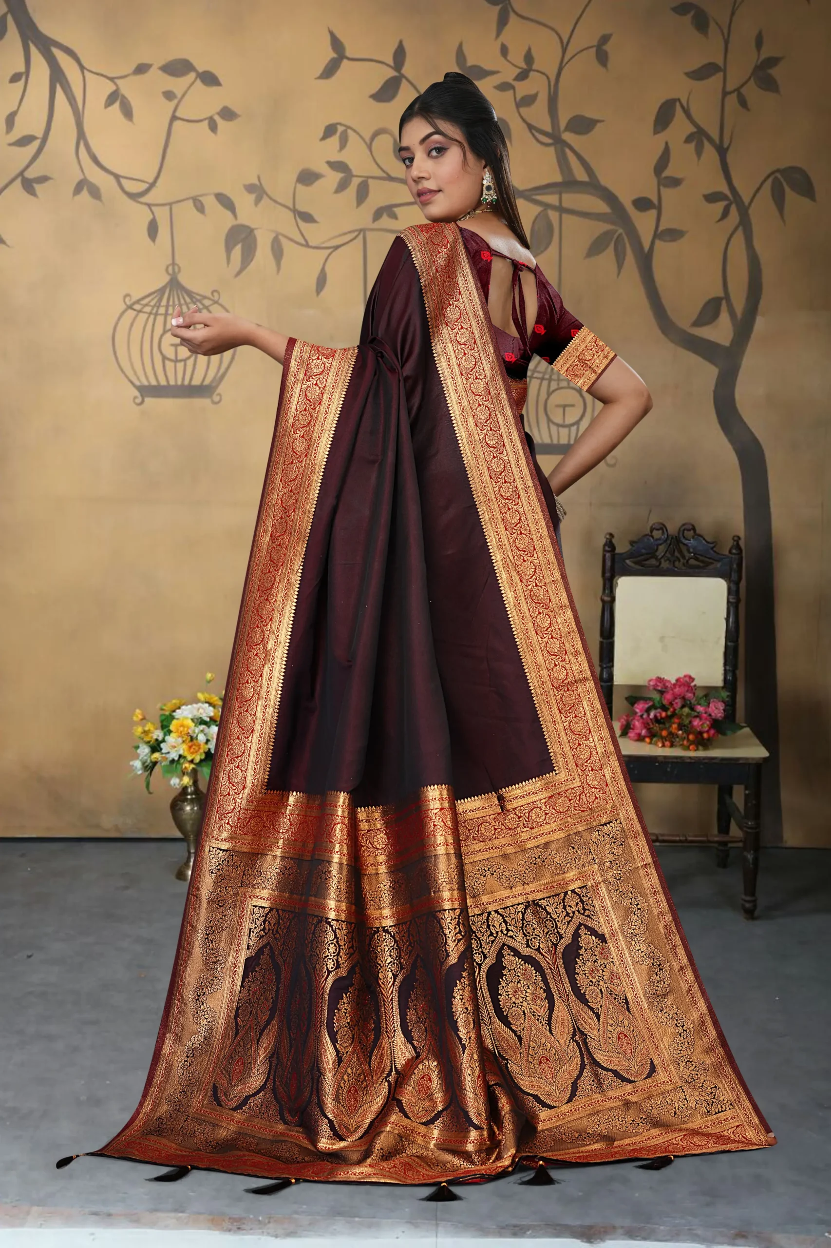 Designer pallu of maroon Banarasi saree with intricate work