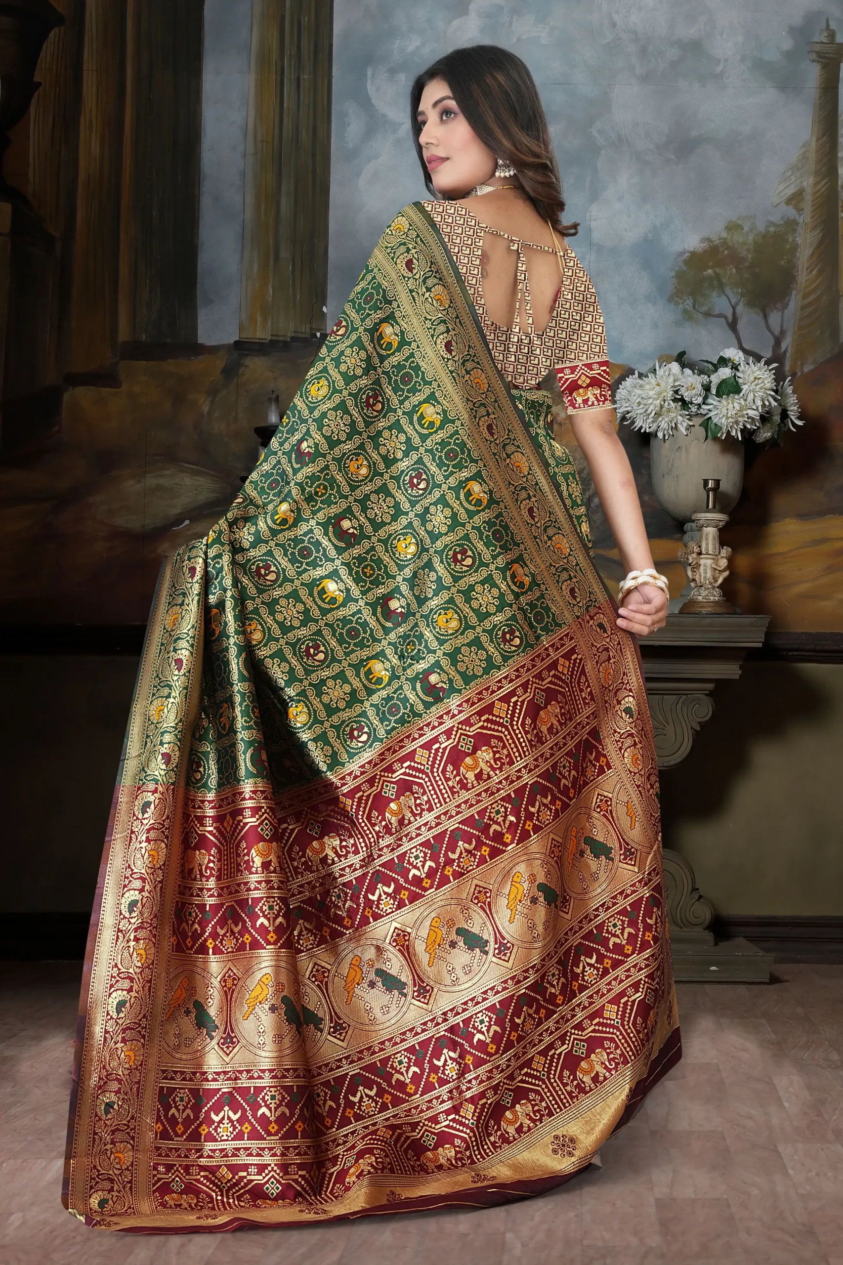 Green silk blend saree with red pallu and zari design